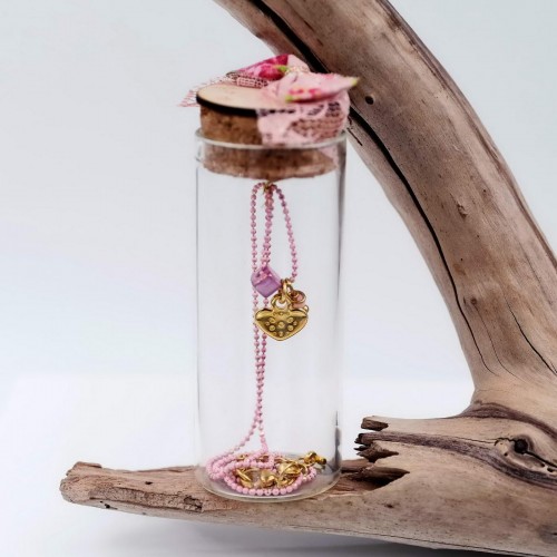 Short gold-plated necklace with heart in a glass bottle
