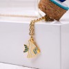 Handmade necklace in a bottle with gold-plated parts and enamel