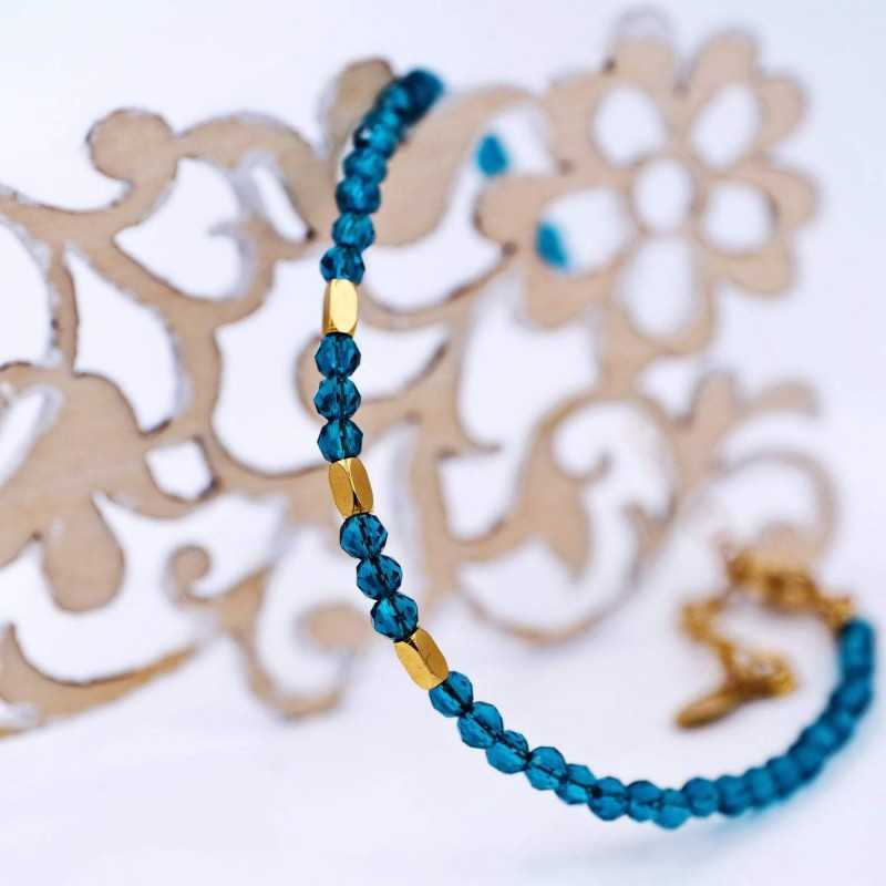 Handmade bracelet made of zircon crystals and gold-plated stainless steel parts