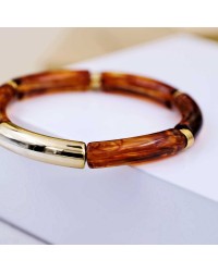 Handmade elastic bracelet with resin and gold-plated metal parts Handmade elastic bracelet with resin and gold-plated metal parts