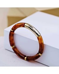 Handmade elastic bracelet with resin and gold-plated metal parts Handmade elastic bracelet with resin and gold-plated metal parts