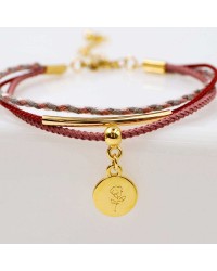 Set of 4 handmade bracelets made of cotton cords and gold-plated metallic parts Set of 4 handmade bracelets made of cotton cords and gold-plated metallic parts