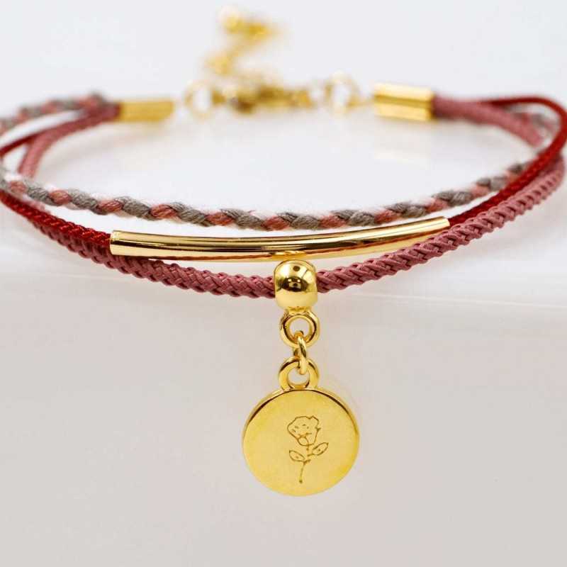 Set of 4 handmade bracelets made of cotton cords and gold-plated metallic parts Set of 4 handmade bracelets made of cotton cords and gold-plated metallic parts