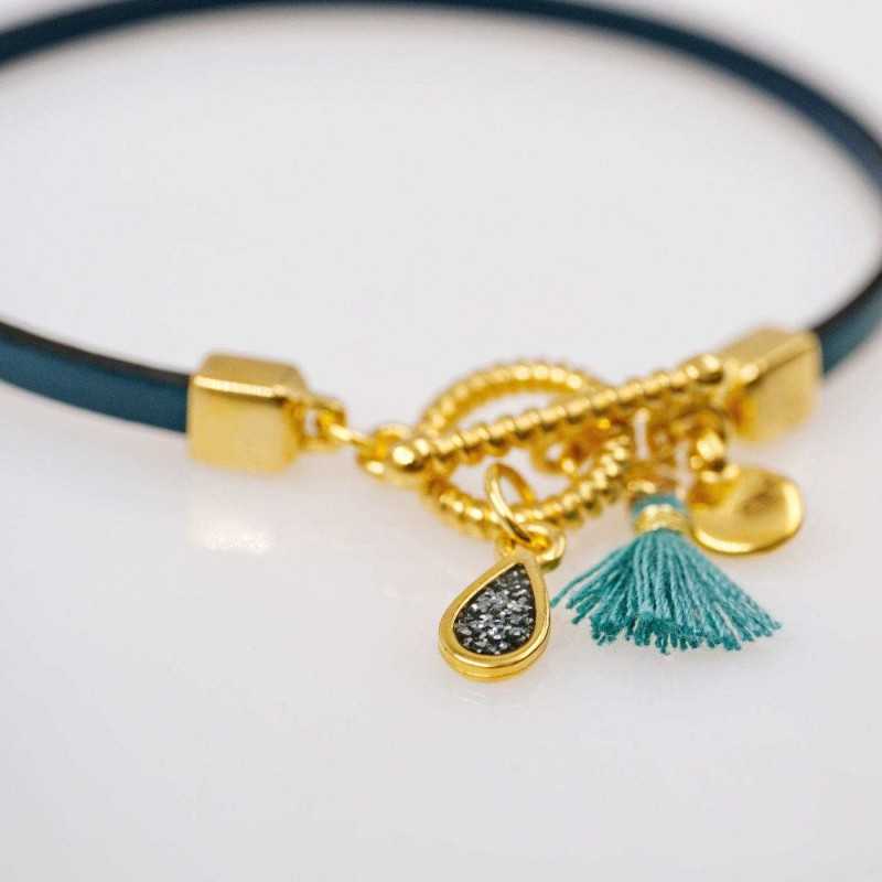 Handmade leather bracelet with gold-plated metal parts Handmade leather bracelet with gold-plated metal parts