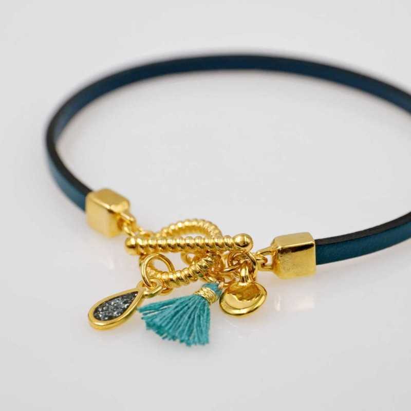 Handmade leather bracelet with gold-plated metal parts Handmade leather bracelet with gold-plated metal parts