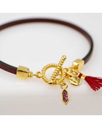 Handmade leather bracelet with gold-plated metal parts Handmade leather bracelet with gold-plated metal parts