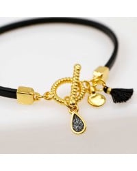 Handmade leather bracelet with gold-plated metal parts Handmade leather bracelet with gold-plated metal parts