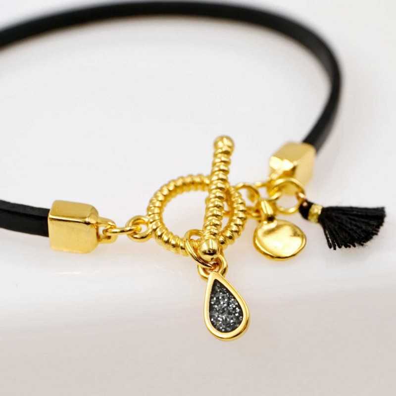Handmade leather bracelet with gold-plated metal parts Handmade leather bracelet with gold-plated metal parts