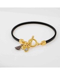 Handmade leather bracelet with gold-plated metal parts Handmade leather bracelet with gold-plated metal parts