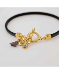Handmade leather bracelet with gold-plated metal parts Handmade leather bracelet with gold-plated metal parts