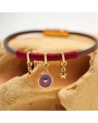 Handmade leather bracelet with rose gold-plated metal parts and enamel Handmade leather bracelet with rose gold-plated metal parts and enamel