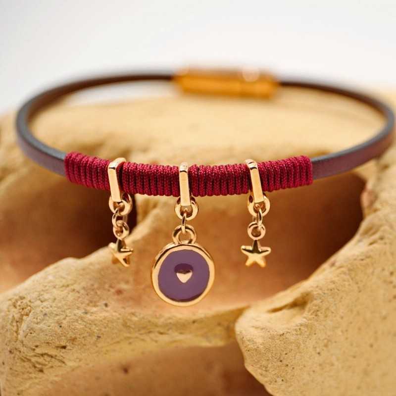 Handmade leather bracelet with rose gold-plated metal parts and enamel Handmade leather bracelet with rose gold-plated metal parts and enamel