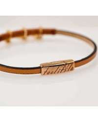 Handmade leather bracelet with rose gold-plated metal parts and enamel Handmade leather bracelet with rose gold-plated metal parts and enamel