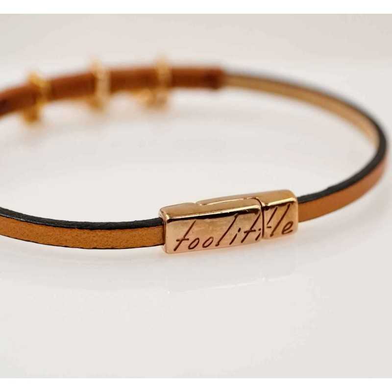 Handmade leather bracelet with rose gold-plated metal parts and enamel Handmade leather bracelet with rose gold-plated metal parts and enamel
