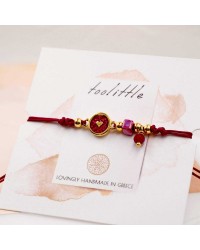 Makrame bracelet with gold-plated enamelled parts Handmade makrame bracelet made of high quality cord with gold-plated enamelled parts