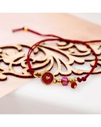 Makrame bracelet with gold-plated enamelled parts Handmade makrame bracelet made of high quality cord with gold-plated enamelled parts