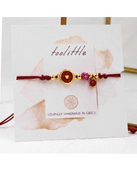 Makrame bracelet with gold-plated enamelled parts Handmade makrame bracelet made of high quality cord with gold-plated enamelled parts