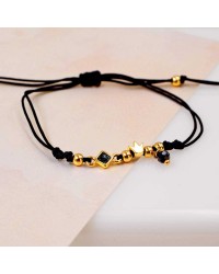 Makrame bracelet with gold-plated crown Handmade makrame bracelet made of high quality cord with gold-plated crown
