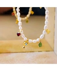 Βραχιόλι Γούρι 2026 με Καλλιεργημένα Μαργαριτάρια Χειροποίητο βραχιόλι γούρι από καλλιεργημένα μαργαριτάρια, κρύσταλλα και σμάλτο