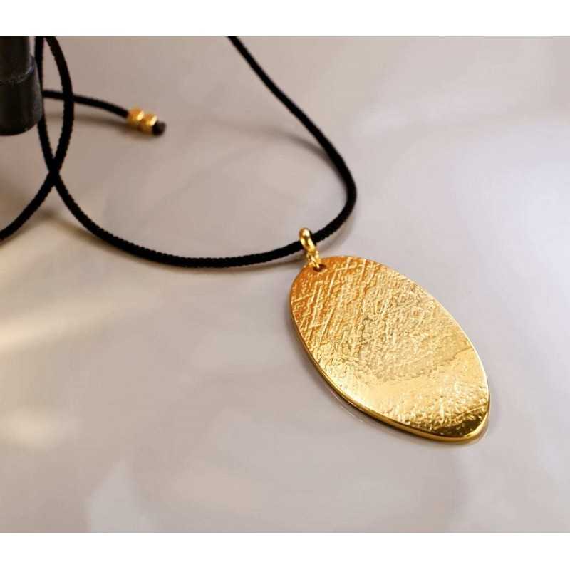 Long necklace with metallic pendant with organic shape